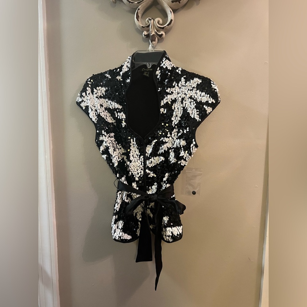 Cartise brand, vg quality, dressy top, Black, open neck line, with sequins.